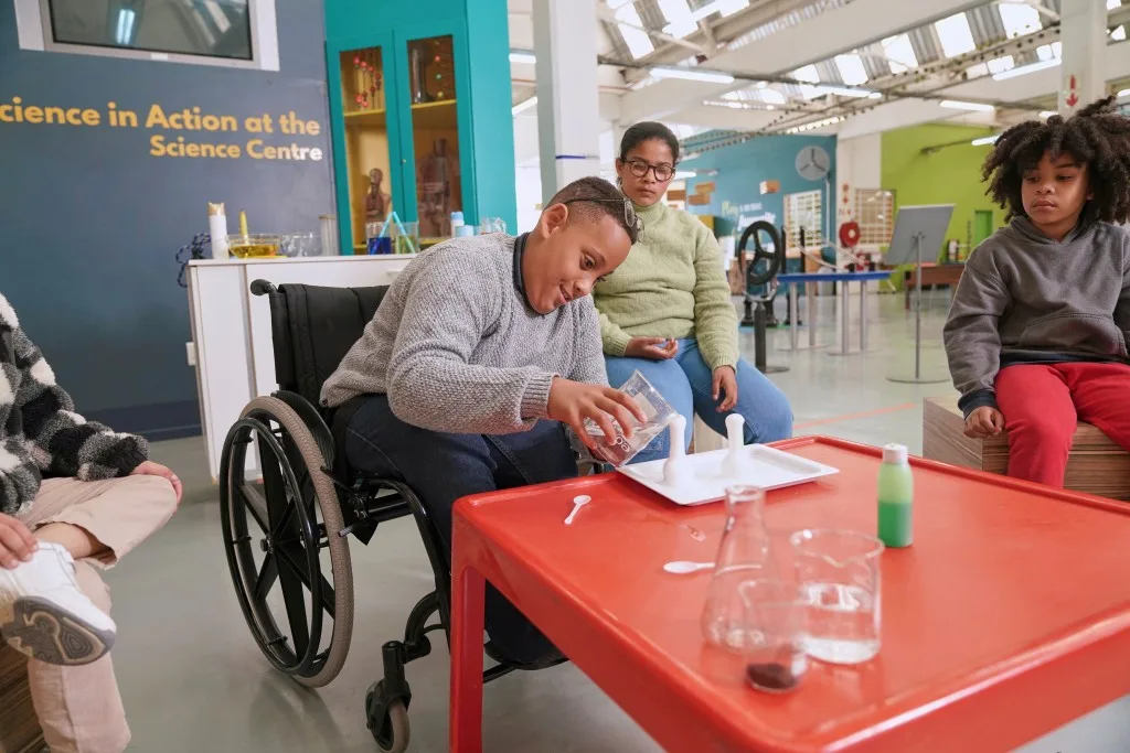A group of friends are gathered together to try out fun science experiments